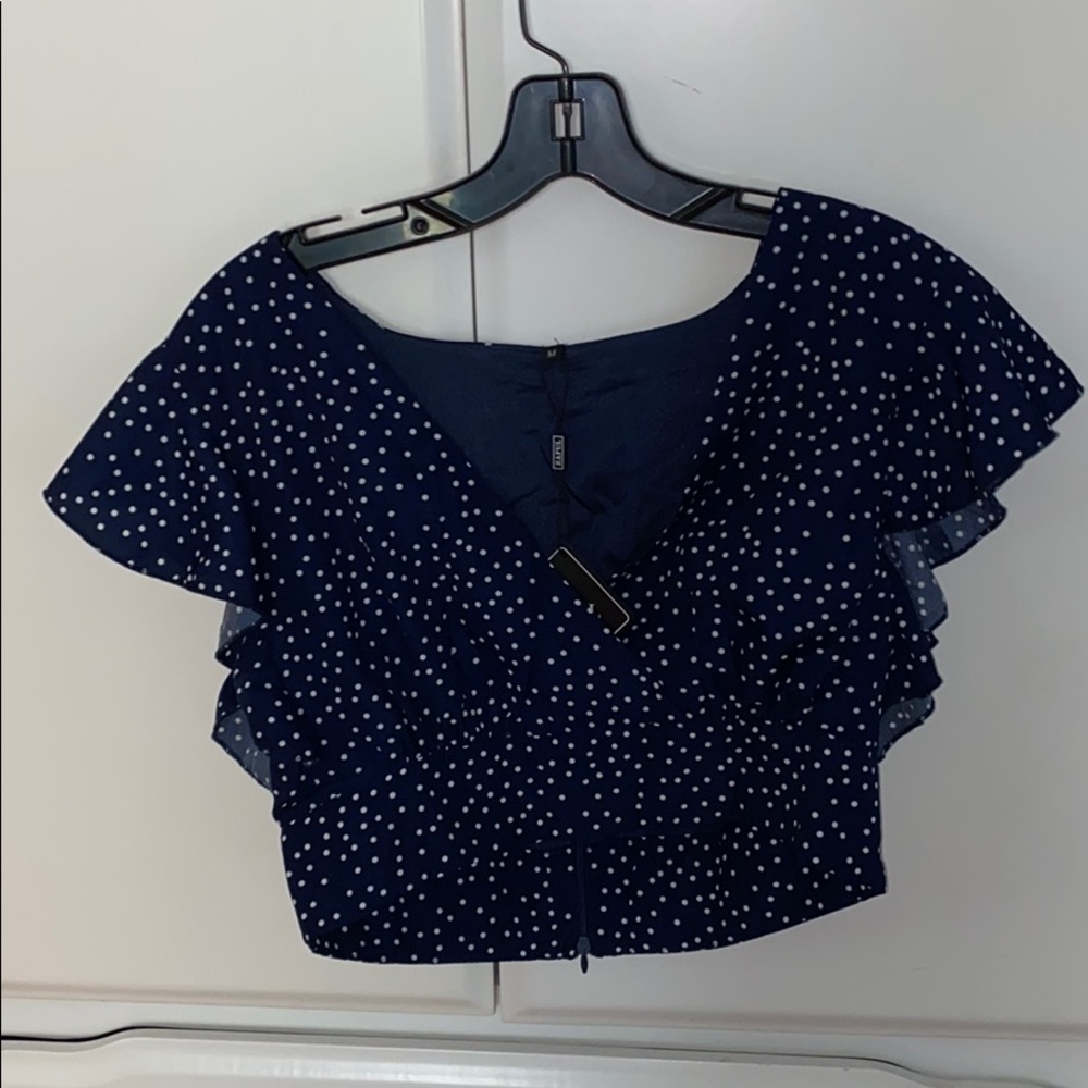 navy polka dot shirt